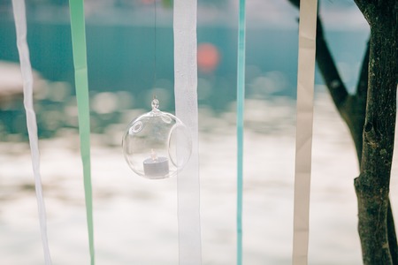 Candles in glass lamps. Wedding decorations. Wedding in Montenegro.の写真素材