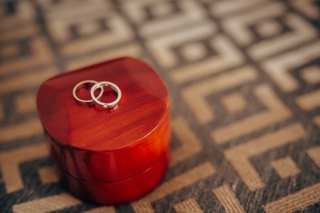 Wedding rings in a red box for rings. Wedding jewelry.の写真素材