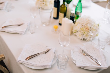 Plates at the wedding banquet. Table setting. Wedding decorations. Wedding at the sea in Montenegro.