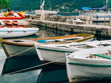 Wooden boats on the water. In the Bay of Kotor in Montenegro. Marine boats.