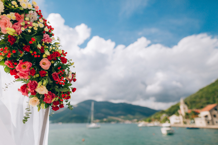 Wedding Arch on the beach in Montenegro. Panoramic views of the mountains and the Bay of Kotorの写真素材