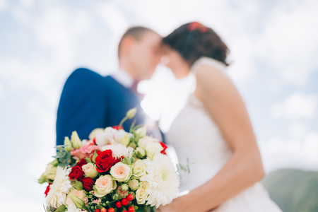 Wedding bridal bouquet of roses, chrysanthemums, Eucalyptus Baby Blue in the hands of the bride. Wedding in Montenegro, Adriatic.の写真素材
