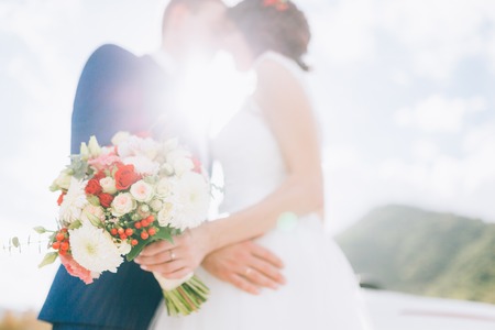 Wedding bridal bouquet of roses, chrysanthemums, Eucalyptus Baby Blue in the hands of the bride. Wedding in Montenegro, Adriatic.の写真素材