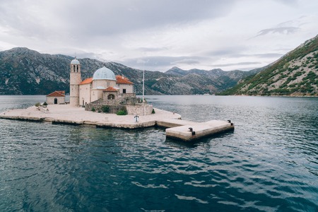 The island of Gospa od Skrpjela, Kotor Bay, Montenegro. Aerial survey of drones.の写真素材