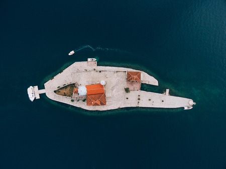 The island of Gospa od Skrpjela, Kotor Bay, Montenegro. Aerial survey of drones.の写真素材