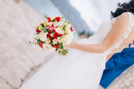 Wedding bridal bouquet of roses, chrysanthemums, Eucalyptus Baby Blue in the hands of the bride. Wedding in Montenegro, Adriatic.の写真素材
