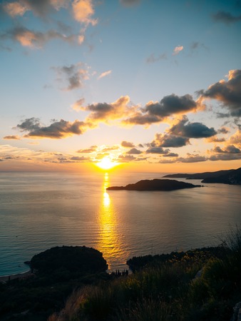 Island of Sveti Stefan close up at sunset. Montenegro, the Adriatic Sea, the Balkans.の写真素材