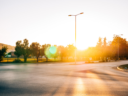 The road to the city of sun and glare at sunset.の写真素材