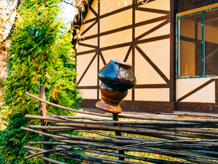 Clay pot on the fence. Ukrainian flavor.の写真素材