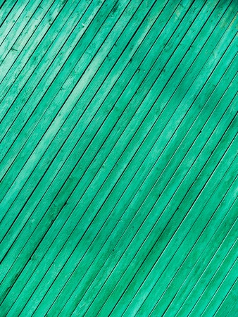 Green doors. Wood texture. Old shabby, irradiated paint. Old wooden doorsの写真素材