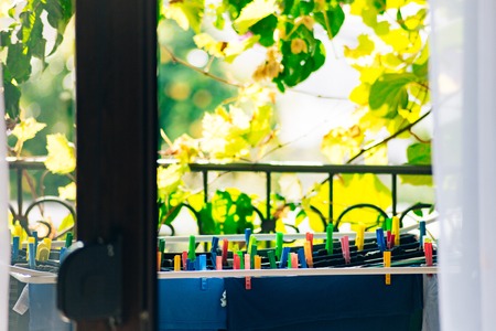Clothes dries on ropes on clothespins. Drying clothes.の写真素材