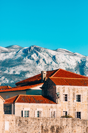 The Old Town of Budva, mountains covered with snow, Montenegroの写真素材