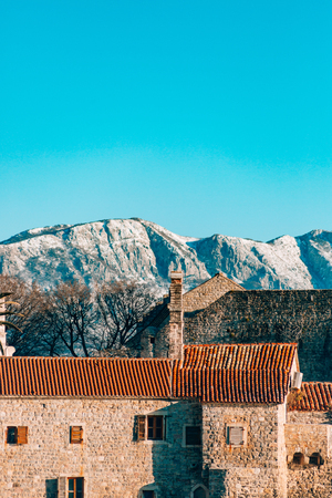 The Old Town of Budva, mountains covered with snow, Montenegroの写真素材