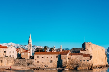 The Old Town of Budva, mountains covered with snow, Montenegroの写真素材
