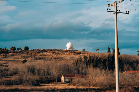 Round white observatory on a hill. Observatory in the mountains of Montenegro, Podgorica.の素材 [FY31085874997]