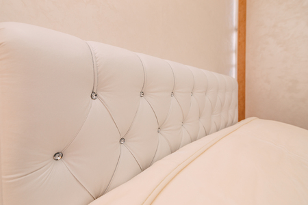 The bedroom in the apartment. Bed, wardrobe, bedside tables in the bedroom of the apartment.の写真素材