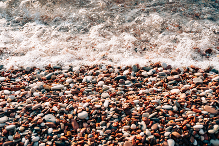 Pebbles on the beach. Texture of the sea shore. The Adriatic Sea in Montenegro.の写真素材