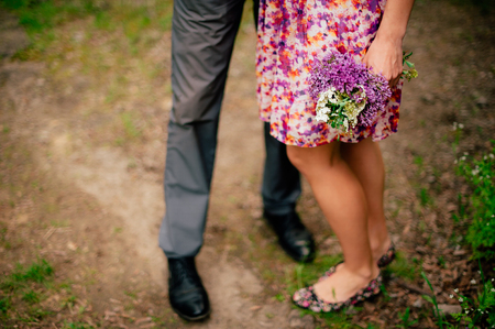 Female and male feet on grass. Wedding in Montenegroの写真素材