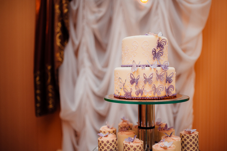 White wedding cake with flowers and blueberriesの写真素材