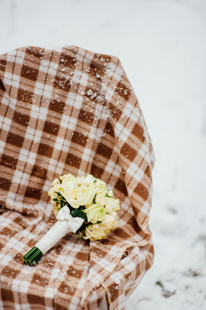 Wedding bouquet on the snow. Wedding in Montenegroの写真素材