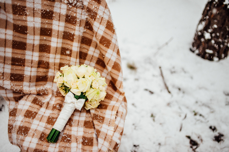 Wedding bouquet on the snow. Wedding in Montenegroの写真素材