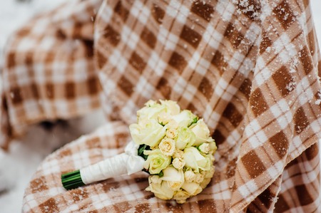 Wedding bouquet on the snow. Wedding in Montenegroの写真素材
