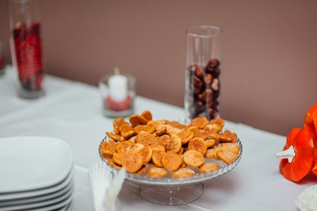 A plate with cookies on the table at the wedding banquet.の写真素材