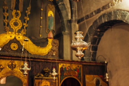 The interior of the church. Icons, chandelier, candles in a small Christian Orthodox church in Montenegro.の写真素材