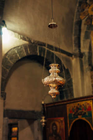 The interior of the church. Icons, chandelier, candles in a small Christian Orthodox church in Montenegro.の写真素材