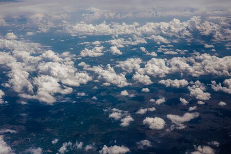 White velvet clouds in the sky, view from the airplane.