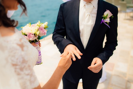 The newlyweds exchange rings at a wedding in Montenegro.の写真素材