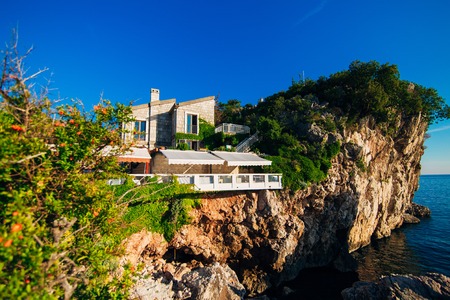 Restaurant on a rock, on a cliff above the sea. Przno in Montenegroの写真素材