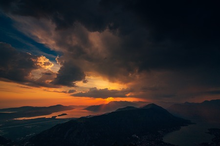 Sunset in Montenegro over the mountains and the sea. Orange sunsets.の写真素材