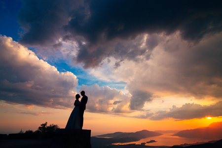 Silhouettes at sunset on Mount Lovcen in Montenegroの写真素材