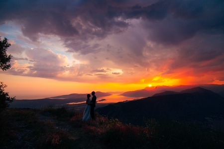 Silhouettes at sunset on Mount Lovcen in Montenegroの写真素材