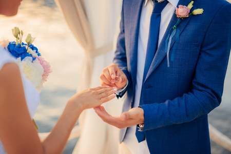 The newlyweds exchange rings at a wedding in Montenegro.の写真素材