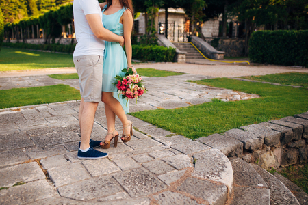 Female and male feet on grass. Wedding in Montenegroの写真素材