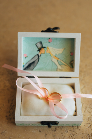 Wedding rings of the newlyweds in a box. Engagement gold rings. Wedding in Montenegro.の写真素材