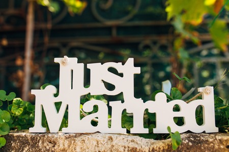 Wooden just married White on the stone floorの写真素材