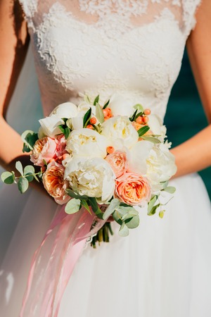 Wedding bouquet in hands of the bride. Wedding in Montenegroの写真素材