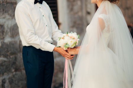 Bride and groom holding hands. Wedding in Montenegroの写真素材