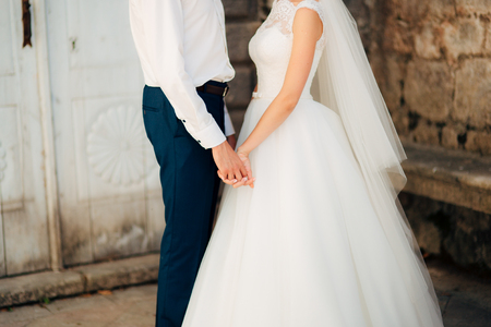 Bride and groom holding hands. Wedding in Montenegroの写真素材