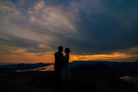 Silhouettes at sunset on Mount Lovcen in Montenegroの写真素材