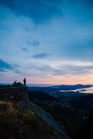 Silhouettes at sunset on Mount Lovcen in Montenegro