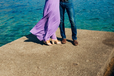 Female and male feet on the dock. Wedding in Montenegroの写真素材