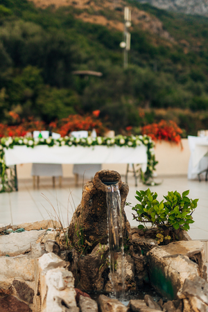 Decorative small waterfall-fountain made of clay pot.の写真素材