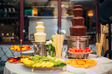 Chocolate fountain on the table at the wedding banquet.の写真素材