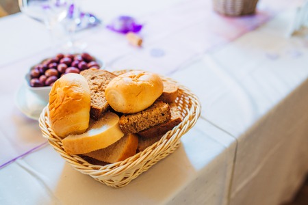 Basket with freshly baked rolls. Decorative basket at the wedding.の写真素材