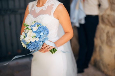 Wedding bouquet in hands of the bride. Wedding in Montenegroの写真素材