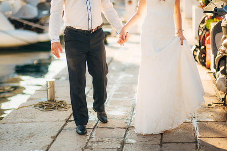 Female and male feet on the rocks. Wedding in Montenegroの写真素材